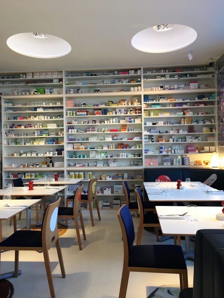 Walls lined with pill bottles at Pharmacy2 